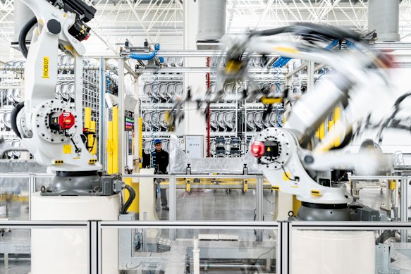 Robots at a Chinese factory of carmaker Zeekr. Altman’s blueprint includes a robot tax to redistribute wealth to those made jobless by AI.