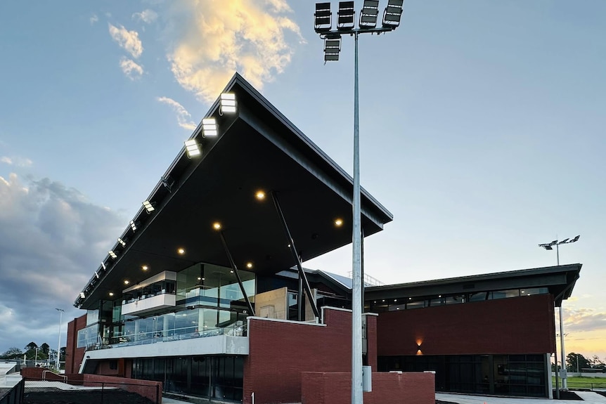 A big building shot from the outside at The Q greyhound race track
