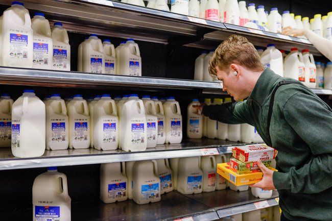 A man takes a milk jerrycans at Coles supermarket. (Photo by Ye Myo Khant / SOPA Images/Sipa USA)