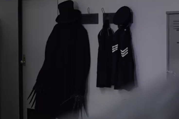 a jacket and hat hanging in a police station.
