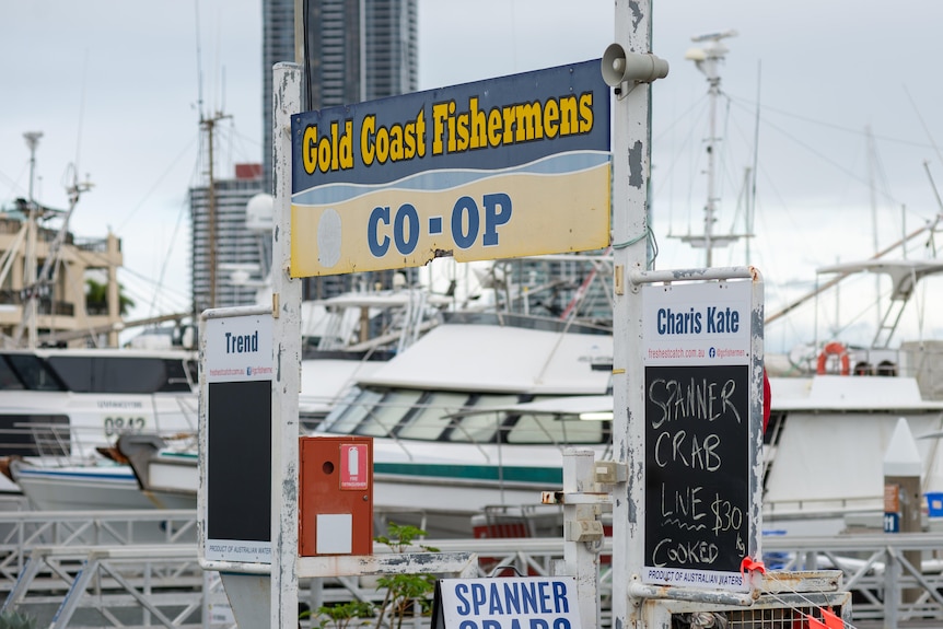 Wide shot of fishermens coop sign