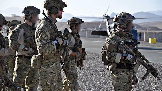 Corporal Ben Roberts-Smith (face unobscured) with his SAS unit in southern Afghanistan in 2010 before the Battle of Shah Wali Kot, for which he was awarded the Victoria Cross. 