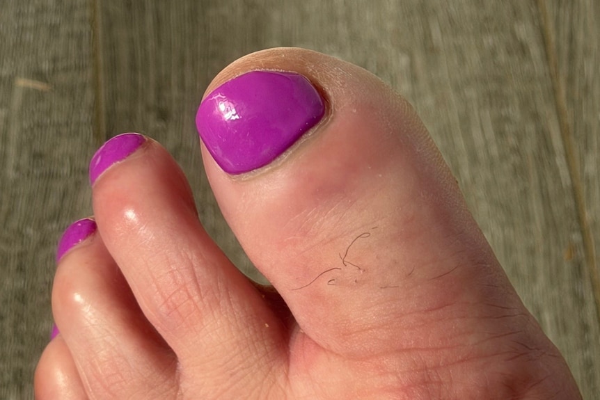 Foot with nail painted pink