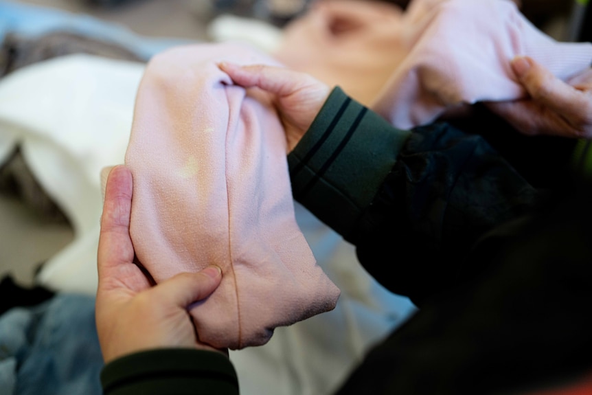 A jumper with a bleach stain