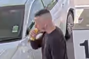 A man with shaved hair in a CCTV still.