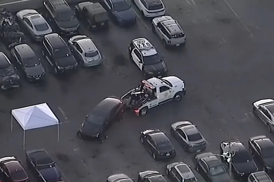 A Tesla registered to Burke is seen being investigated by the LAPD.