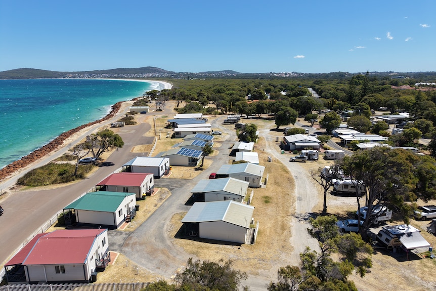 A drone shot of park homes and water