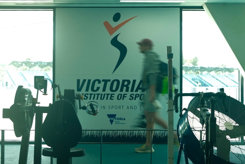 Sam Williamson walks on a treadmill