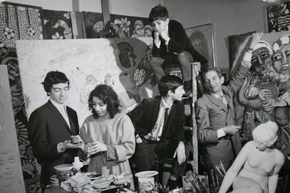 The Mora family in Mirka’s Studio at the Tolarno Hotel in 1967. From left to right: Philippe, Mirka, William, Tiriel (on ladder) and Georges.