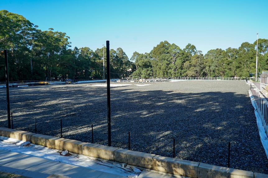 a gravel covered football field