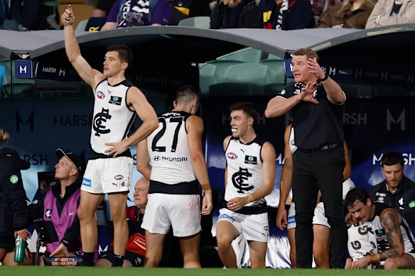Michael Voss rallies his troops from the bench. 