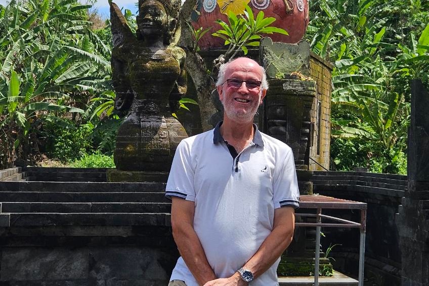 A man stands outside. 