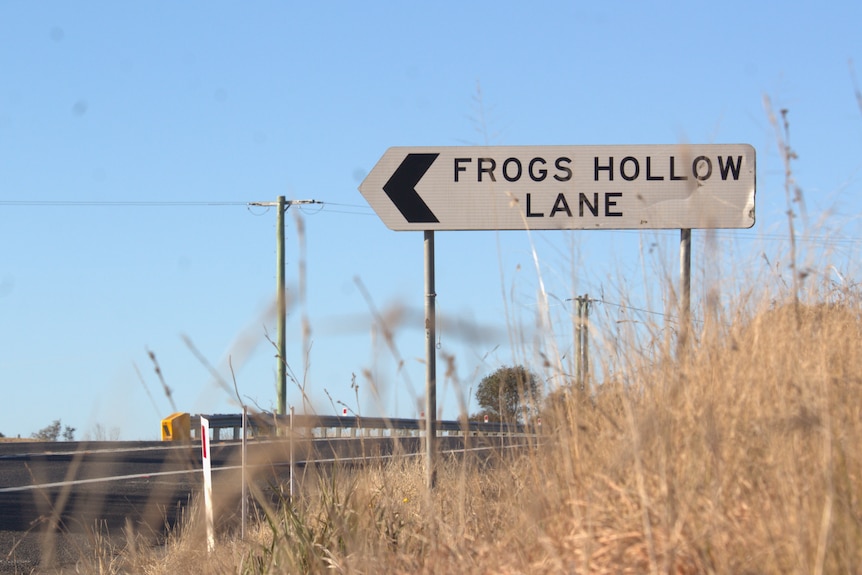 A road sign on a country road.