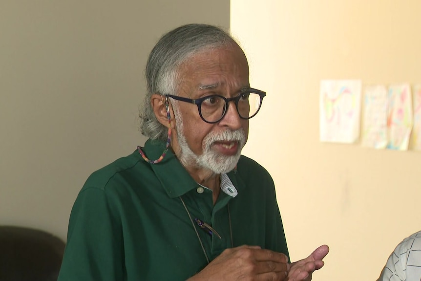 Suresh Rajan speaks to reporters. 