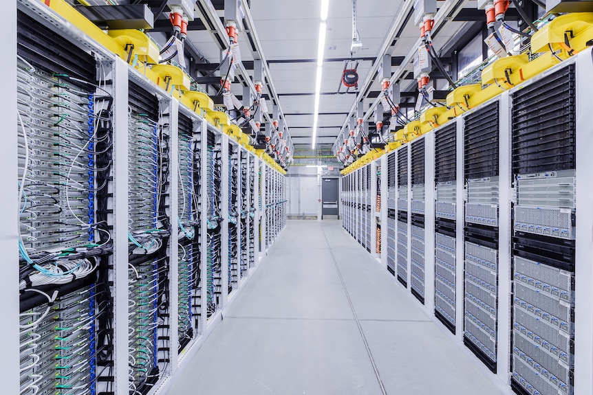 Long rows of machines stretching into the distance at a Microsoft data center.