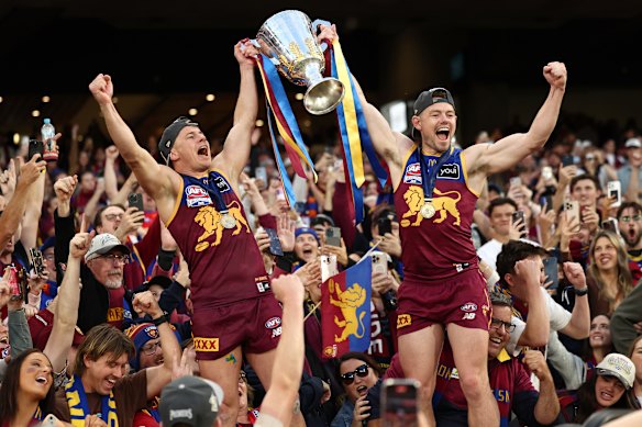 Neale (right) and Dayne Zorko (left) celebrate another premiership.