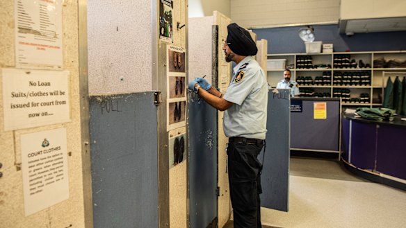 A prison officer talks to an inmate at Silverwater during the screening process.