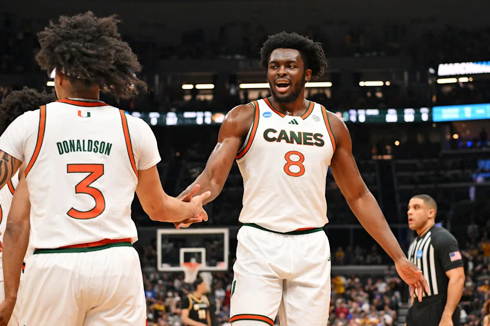 Mar 20, 2026; St. Louis, MO, USA; Miami (FL) Hurricanes center Ernest Udeh Jr. (8) and Miami (FL) Hurricanes guard Tre Donaldson (3) react after a play during the first half against the Missouri Tigers during a first round game of the men's 2026 NCAA Tournament at Enterprise Center. Mandatory Credit: Jeff Curry-Imagn Images