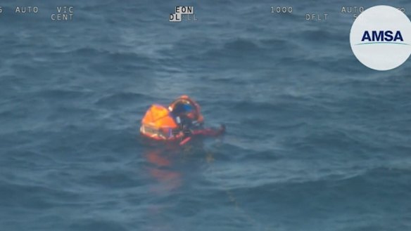 An image of the men in the life raft. 