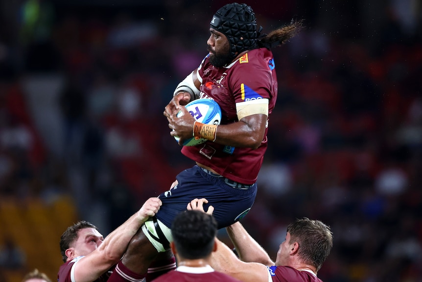 Seru Uru wins a line-out for the Reds.