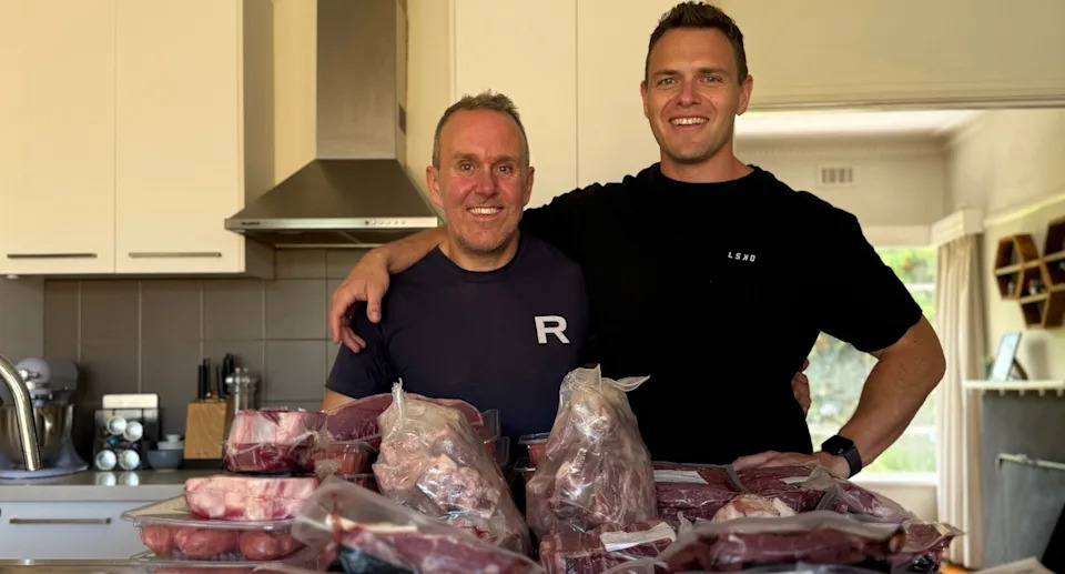 Matt Hall and Ben Borg and half a cow