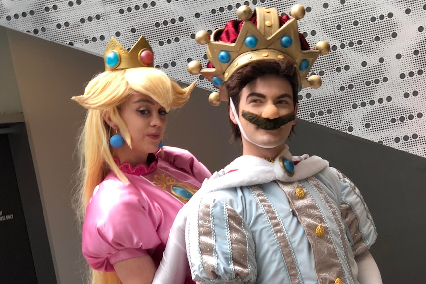 A man and woman dressed in costume