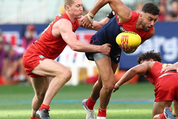 Matt Rowell tackles Christian Salem.