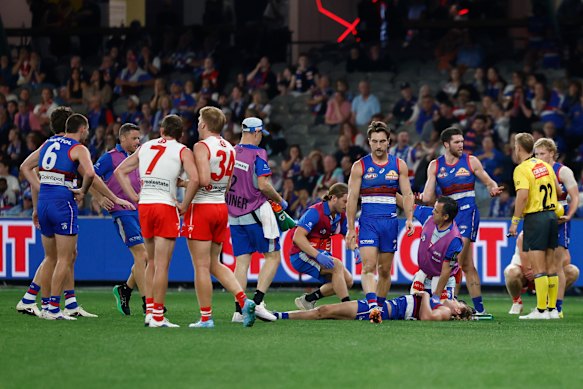 Aaron Naughton is treated by medical staff after his horror fall.
