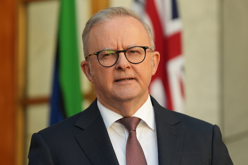 A close-up shot of Anthony Albanese wearing a suit and tie
