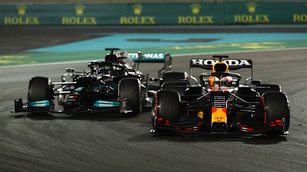 Max Verstappen of the Netherlands driving the (33) Red Bull Racing RB16B Honda leads Lewis Hamilton of Great Britain driving the (44) Mercedes AMG Petronas F1 Team Mercedes W12 during the F1 Grand Prix of Abu Dhabi at Yas Marina Circuit on December 12, 2021 in Abu Dhabi, United Arab Emirates. (Photo by Joe Portlock - Formula 1/Formula 1 via Getty Images)