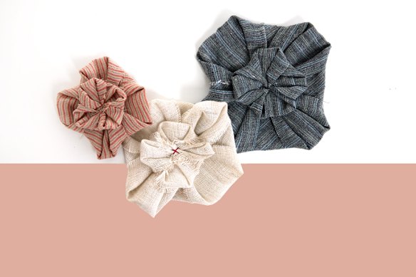 Eva Cassis “Fabric Flower” brooches, handmade from premium linen offcuts.