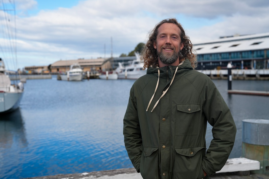 Keiran Quartly standing at the Hobart waterfront.