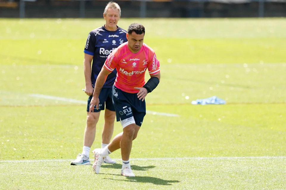 Pictured left to right, Storm coach Craig Bellamy and halfback Jahrome Hughes.