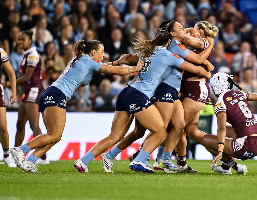 Mackenzie Weale is met by the Blues defence from the kick off.