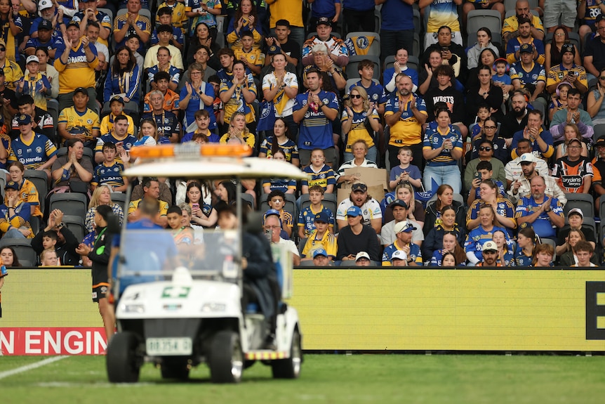 Bailey Simonsson is carted off the field