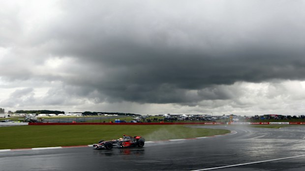 Heavy clouds hang over the circuit as Lewis Hamilton, McLaren MP4-23 Mercedes, 1st position, presses on to victory. Action. Atmosphere. (Photo by Andrew Ferraro/LAT Images)