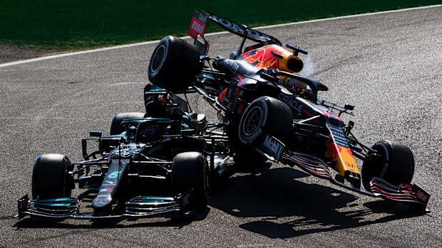 Max Verstappen, Red Bull Racing RB16B Honda collides with Sir Lewis Hamilton, Mercedes W12 during the Italian GP at Autodromo Nazionale Monza on Sunday September 12, 2021 in Monza, Italy. (Photo by Zak Mauger/LAT Images)
