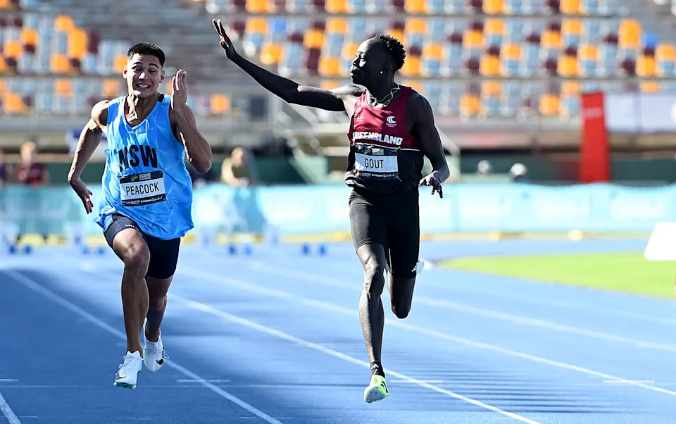 Gout Gout, pictured here waving to the crowd before the end of the race.