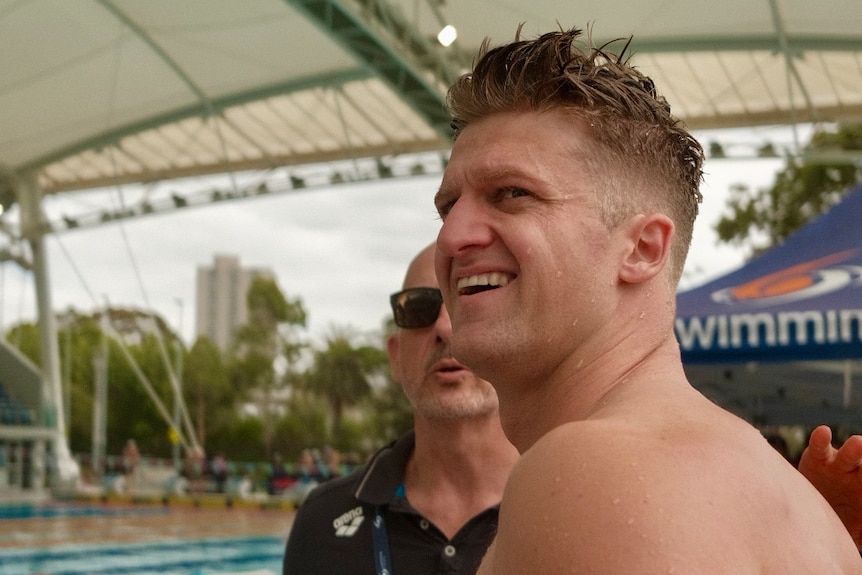 Sam Williamson looks over his shoulder and smiles