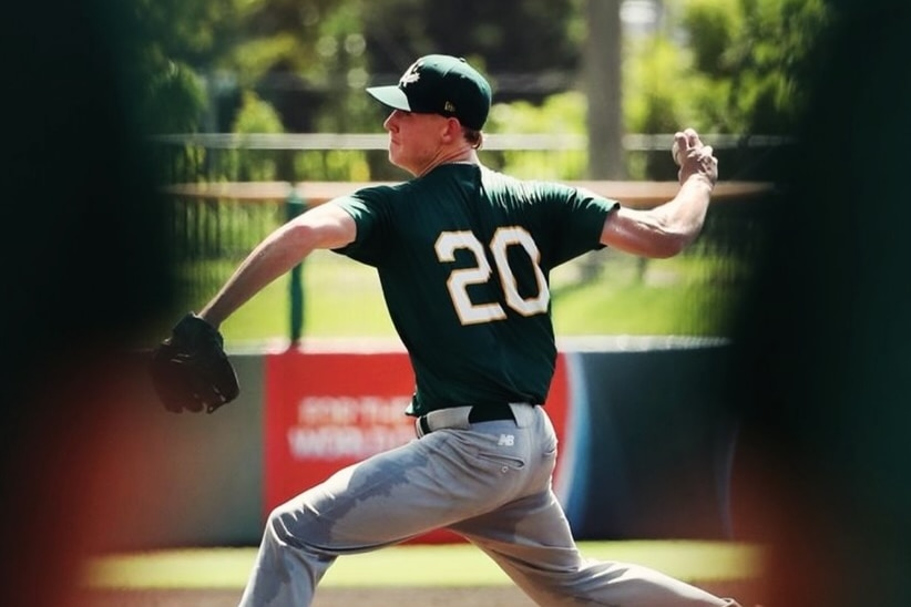 A baseball player prepares to throw a ball