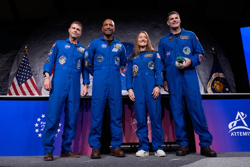 astronauts Reid Wiseman, Victor Glover, and Christina Koch, and Jeremy Hansen pose for a photo