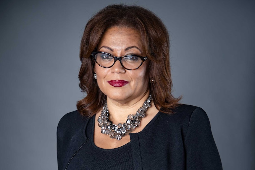 Tanya Hosch stands smiling.