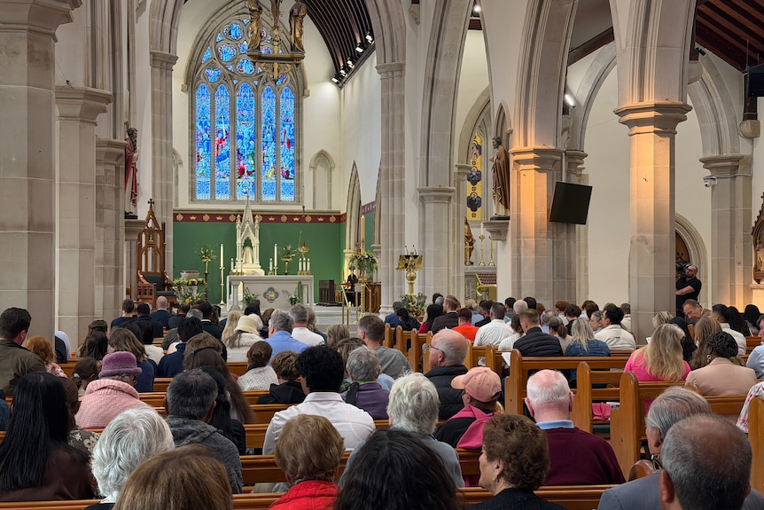 People sitting inside a church.