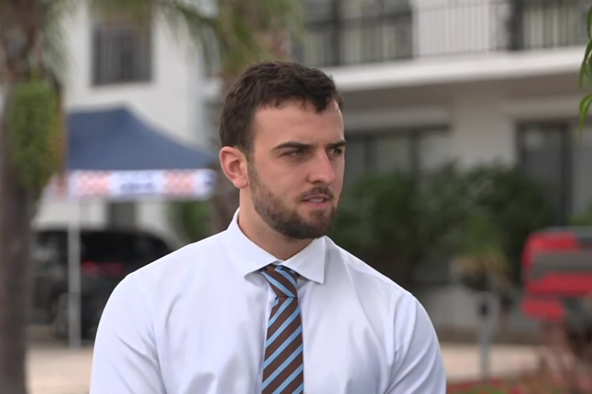 A man in a white shirt and tie.