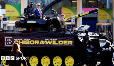 Derek Chisora and Nigel Farage on a tank