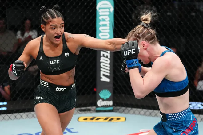 LAS VEGAS, NEVADA - APRIL 04: (L-R) Alice Pereira of Brazil punches Hailey Cowan in a bantamweight fight during the UFC Fight Night event at Meta APEX on April 04, 2026 in Las Vegas, Nevada. (Photo by Jeff Bottari/Zuffa LLC)