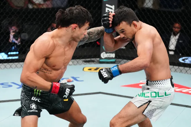 LAS VEGAS, NEVADA - APRIL 04: (L-R) Alessandro Costa of Brazil punches Stewart Nicoll of Solomon Islands in a flyweight fight during the UFC Fight Night event at Meta APEX on April 04, 2026 in Las Vegas, Nevada. (Photo by Jeff Bottari/Zuffa LLC)
