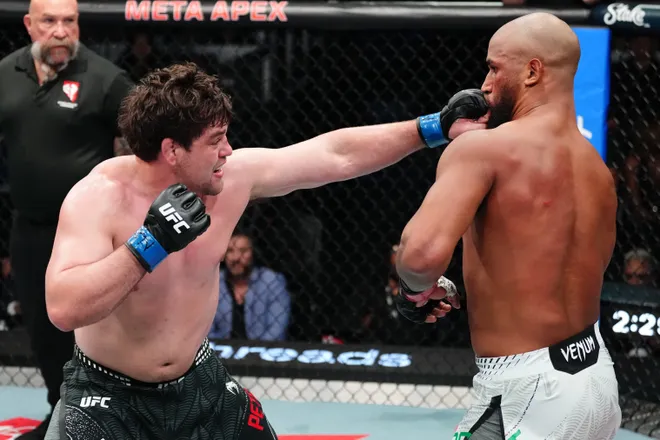 LAS VEGAS, NEVADA - APRIL 04: (L-R) Thomas Petersen punches Guilherme Pat of Brazil in a heavyweight fight during the UFC Fight Night event at Meta APEX on April 04, 2026 in Las Vegas, Nevada. (Photo by Jeff Bottari/Zuffa LLC)