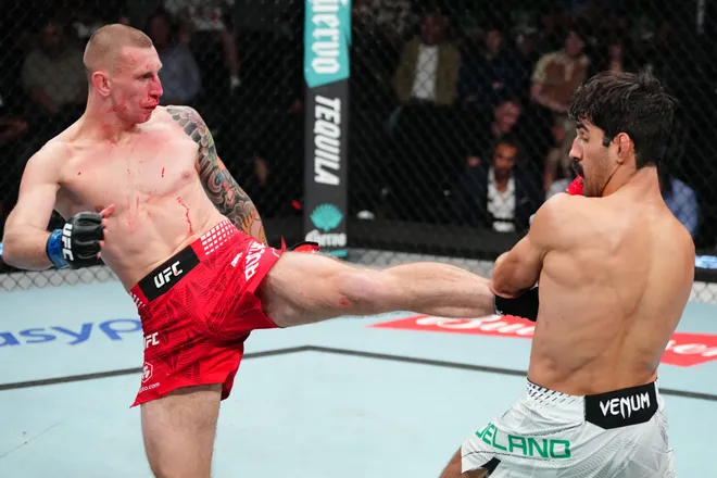 LAS VEGAS, NEVADA - APRIL 04: (L-R) Robert Ruchala of Poland kicks Jose Delano of Brazil in a featherweight fight during the UFC Fight Night event at Meta APEX on April 04, 2026 in Las Vegas, Nevada. (Photo by Jeff Bottari/Zuffa LLC)