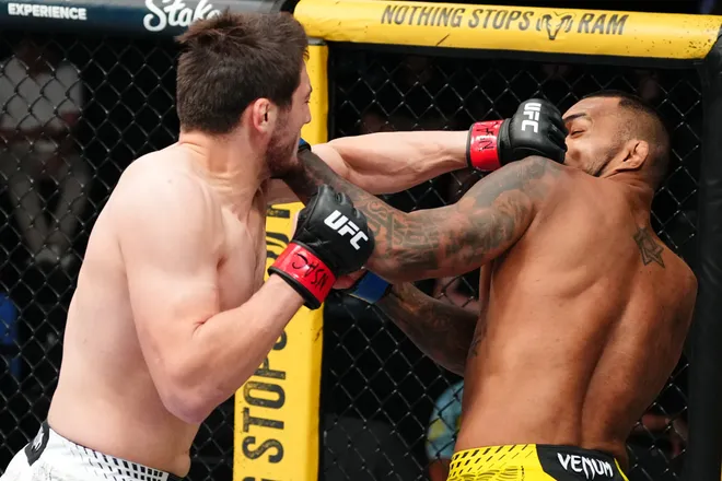 LAS VEGAS, NEVADA - APRIL 04: (L-R) Abdul Rakhman Yakhyaev of Russia punches Brendson Ribeiro of Brazil in a light heavyweight fight during the UFC Fight Night event at Meta APEX on April 04, 2026 in Las Vegas, Nevada. (Photo by Jeff Bottari/Zuffa LLC)